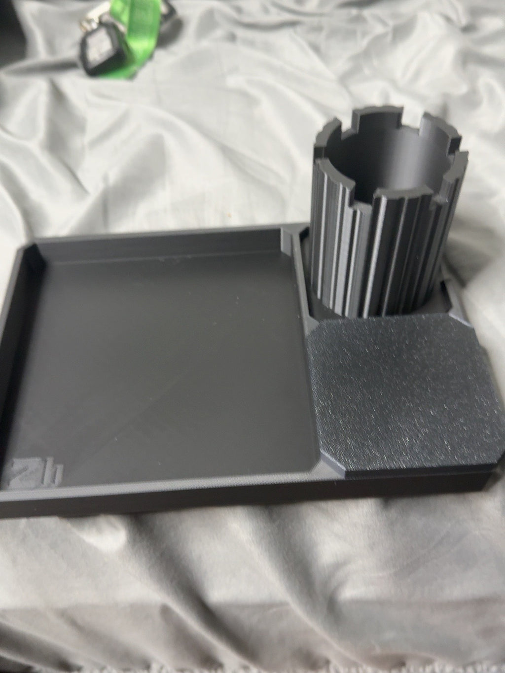 Actual black PLA Z Tray prototype with rook pen cup and covered tray; final launch kit and new attachments are still being validated.