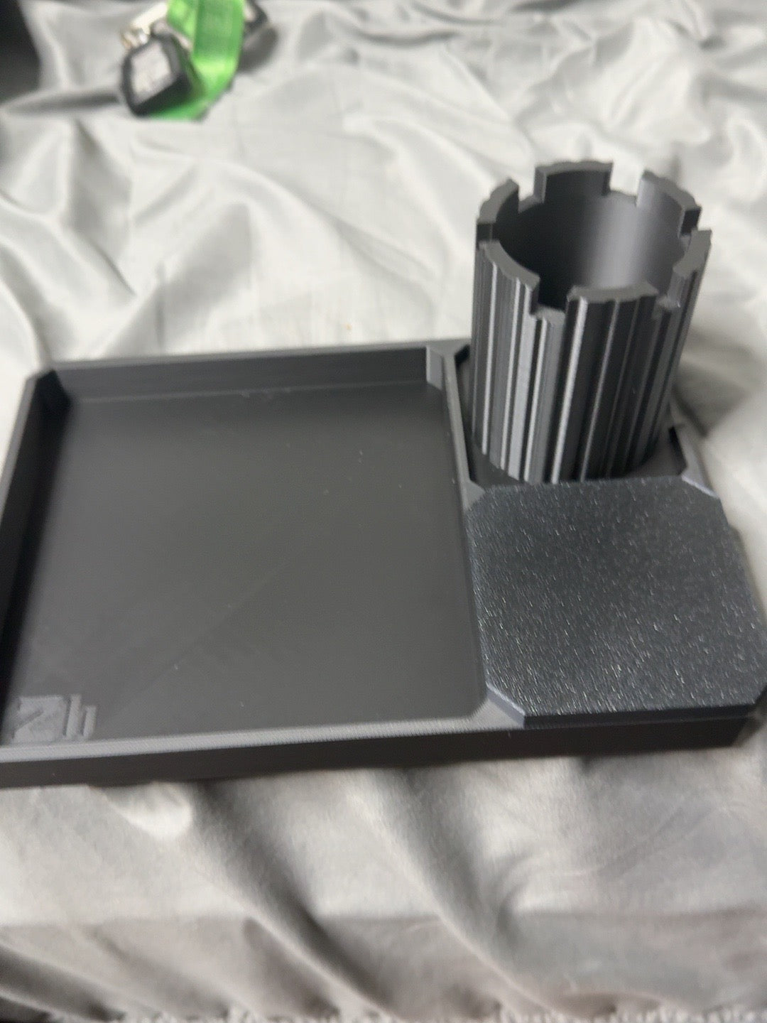 Actual black PLA Z Tray prototype with rook pen cup and covered tray; final launch kit and new attachments are still being validated.